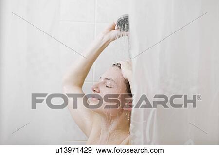 Woman taking shower View Large Photo Image Stock Photo - Woman taking shower. Fotosearch
