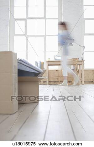 Woman walks across loft apartment blurred motion View Large Photo Image Stock Photography - Woman walks across loft apartment blurred motion. Fotosearch