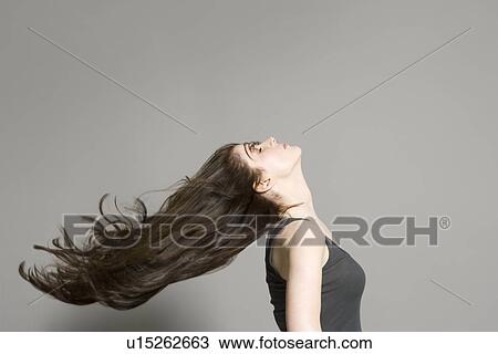 Stock Image - Woman with long brown hair. Fotosearch
