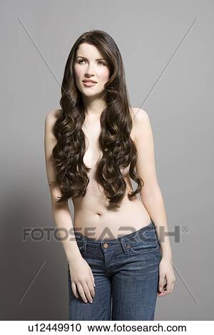 Stock Image - Woman with long brown wavy hair. Fotosearch