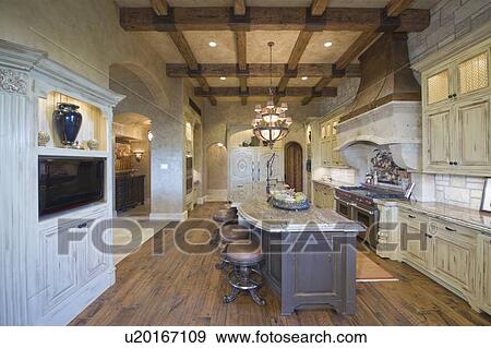 Stock Photo - Wood beamed ceiling of Palm Springs kitchen. Fotosearch