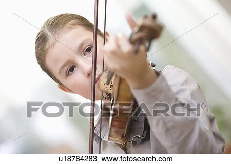 Young girl playing violin View Large Photo Image Stock Image - Young girl playing violin. Fotosearch