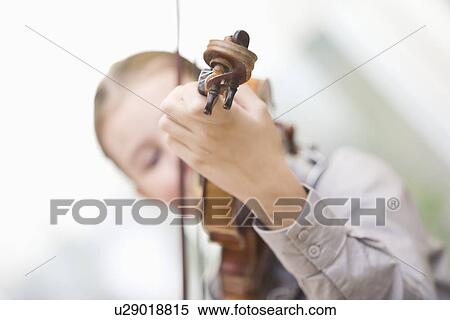 Young girl playing violin View Large Photo Image Stock Photography - Young girl playing violin. Fotosearch