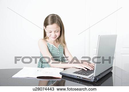 Young Team doing her homework View Large Photo Image Stock Image - Young Team doing her homework. Fotosearch