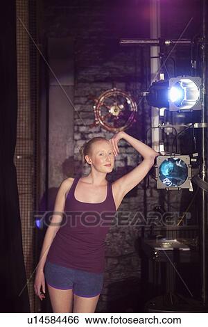 Young woman backstage View Large Photo Image Stock Photograph - Young woman backstage. Fotosearch