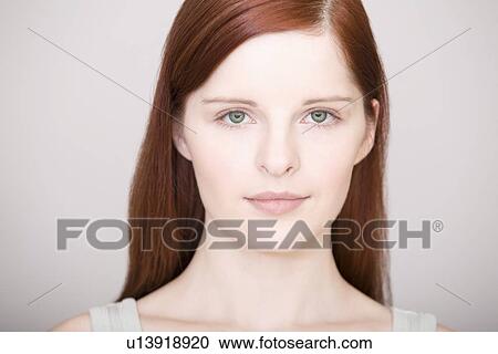 Stock Image - Young woman front view portrait. Fotosearch