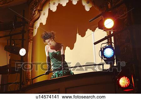 Young woman in theatre box View Large Photo Image Stock Image - Young woman in theatre box. Fotosearch