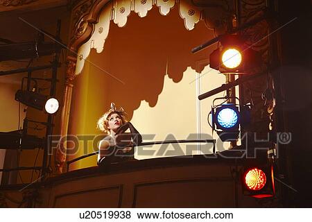 Stock Photo - Young woman in theatre box. Fotosearch