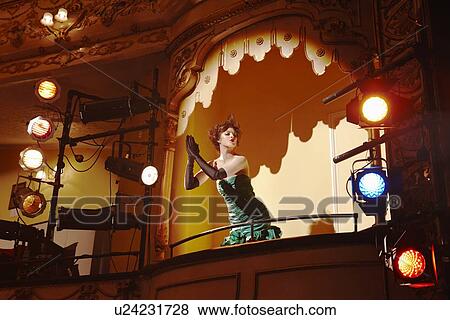 Stock Photo - Young woman in theatre box. Fotosearch