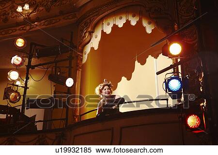 Stock Photography - Young woman in theatre box. Fotosearch