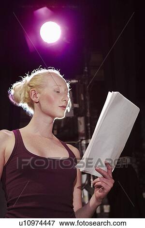 Young woman on stage close up View Large Photo Image Stock Photo - Young woman on stage close up. Fotosearch