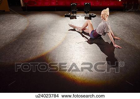 Picture - Young woman on stage. Fotosearch