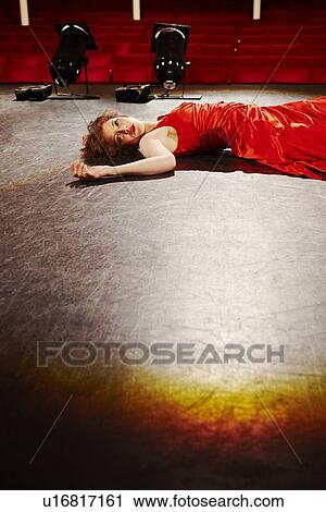 Stock Image - Young woman on stage. Fotosearch