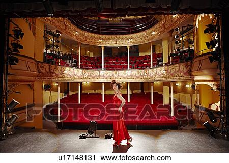 Stock Image - Young woman on stage. Fotosearch