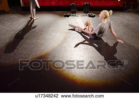 Young woman on stage View Large Photo Image Stock Image - Young woman on stage. Fotosearch