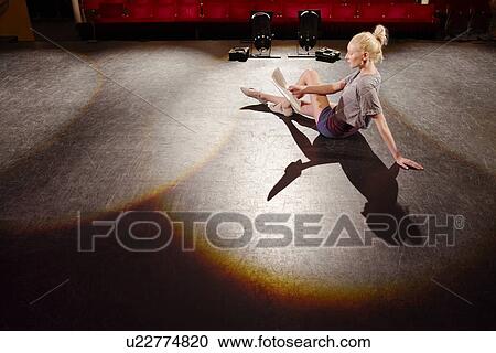 Young woman on stage View Large Photo Image Stock Image - Young woman on stage. Fotosearch