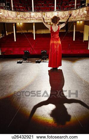 Young woman on stage View Large Photo Image Stock Image - Young woman on stage. Fotosearch