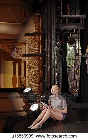 Young woman on stage View Large Photo Image Stock Photo - Young woman on stage. Fotosearch