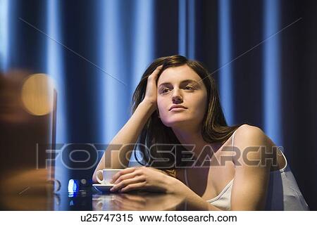 Young woman relaxing at bar View Large Photo Image Stock Photography - Young woman relaxing at bar. Fotosearch