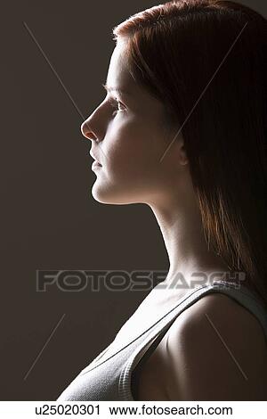 Young woman side view portrait View Large Photo Image Stock Image - Young woman side view portrait. Fotosearch