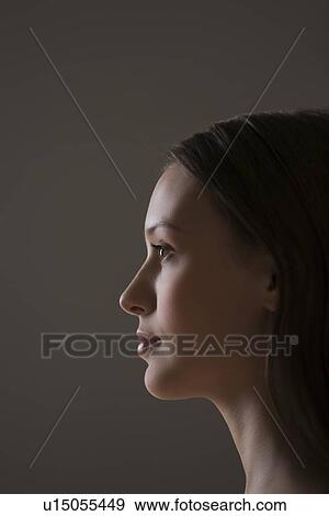 Young woman side view portrait View Large Photo Image Stock Photo - Young woman side view portrait. Fotosearch
