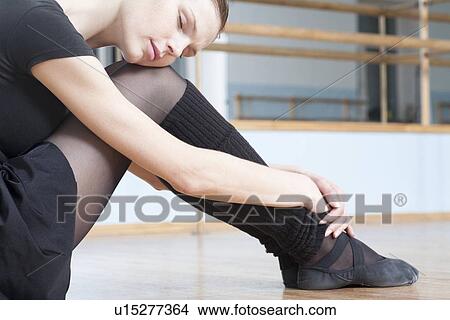 Young woman sits resting in rehearsal room View Large Photo Image Picture - Young woman sits resting in rehearsal room. Fotosearch
