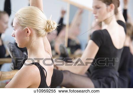 Young women practise ballet at the barre View Large Photo Image Stock Photography - Young women practise ballet at the barre. Fotosearch