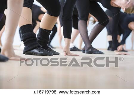 Young women practise ballet in a rehearsal room View Large Photo Image Stock Photo - Young women practise ballet in a rehearsal room. Fotosearch