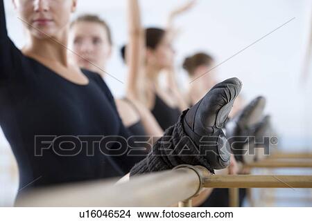 Young women practising at the barre View Large Photo Image Picture - Young women practising at the barre. Fotosearch