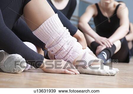 Young women sit resting in rehearsal room View Large Photo Image Stock Photo - Young women sit resting in rehearsal room. Fotosearch