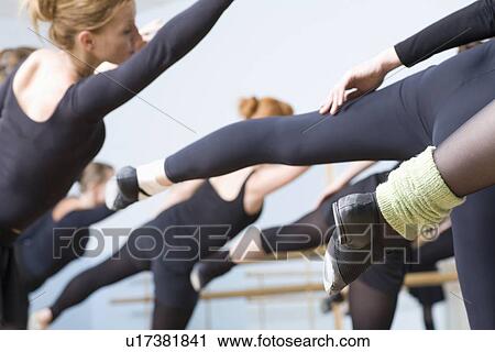 Young women stretch into ballet positions View Large Photo Image Stock Image - Young women stretch into ballet positions. Fotosearch