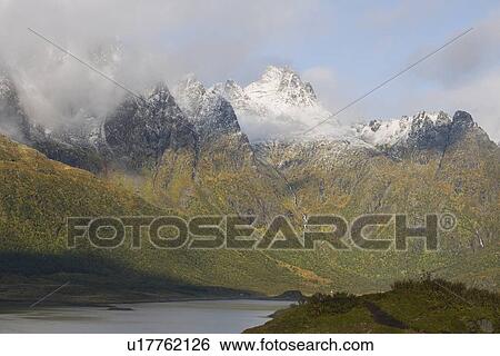 Stock Photograph - Cloud cover on mountains, Lofoten Islands, Norway. Fotosearch