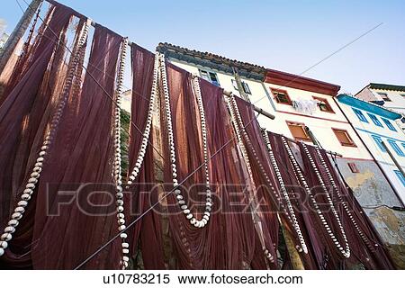 Fishing nets in fishing town of Cudillero, Asturias, Spain View Large Photo Image Stock Photography - Fishing nets in fishing town of Cudillero, Asturias, Spain. Fotosearch