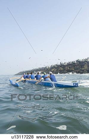 Outrigger canoeing team in training View Large Photo Image Stock Photo - Outrigger canoeing team in training. Fotosearch