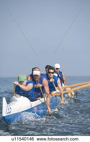 Outrigger canoeing team on water View Large Photo Image Stock Photograph - Outrigger canoeing team on water. Fotosearch
