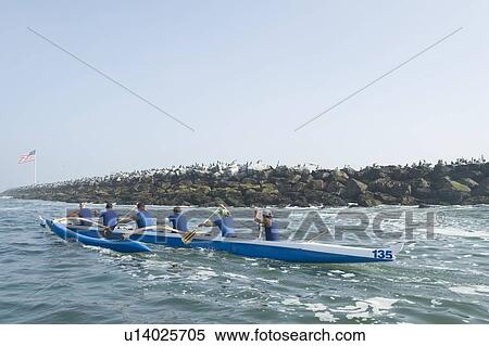 Outrigger canoeing team on water View Large Photo Image Stock Photography - Outrigger canoeing team on water. Fotosearch