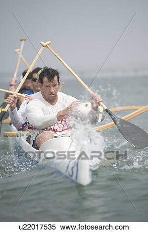 Outrigger canoeing team on water View Large Photo Image Stock Photography - Outrigger canoeing team on water. Fotosearch