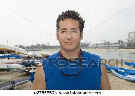 Stock Image - Portrait of sportsman in marina. Fotosearch
