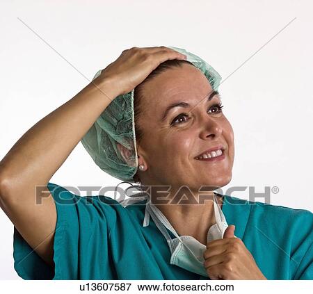 Theatre nurse after surgery View Large Photo Image Stock Photo - Theatre nurse after surgery. Fotosearch