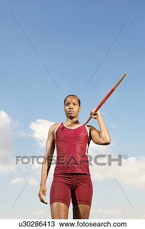 Stock Image - Athlete with javelin, half length. Fotosearch