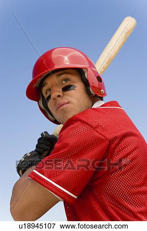 Stock Photo - Baseball batter waiting for pitch, (low angle view). Fotosearch