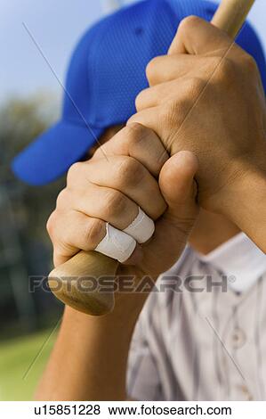Stock Photo - Baseball batter waiting for pitch, (close-up). Fotosearch