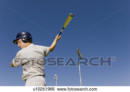 Baseball batter warming up in before match, (low angle view) View Large Photo Image Stock Photograph - Baseball batter warming up in before match, (low angle view). Fotosearch