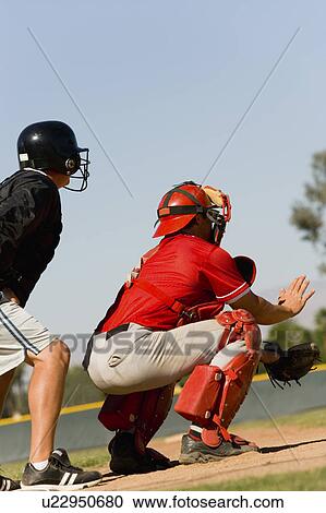 Baseball catcher and umpire on baseball field View Large Photo Image Stock Image - Baseball catcher and umpire on baseball field. Fotosearch