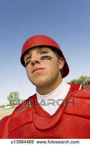Stock Photo - Baseball catcher on field, (close-up). Fotosearch