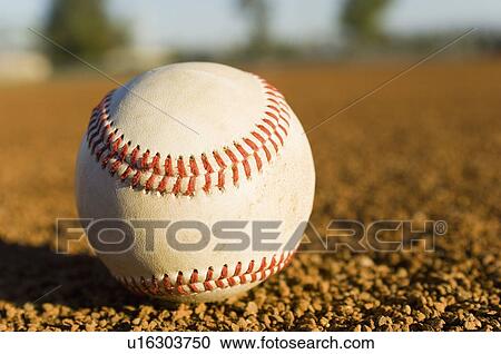 Baseball on ground, (close-up) View Large Photo Image Stock Image - Baseball on ground, (close-up). Fotosearch