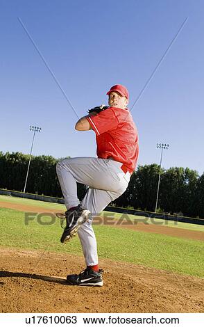 Stock Image - Baseball pitcher getting ready to pitch. Fotosearch