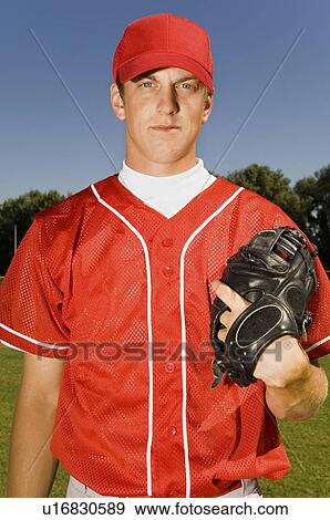 Baseball pitcher holding glove, (portrait) View Large Photo Image Stock Photo - Baseball pitcher holding glove, (portrait). Fotosearch