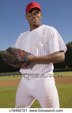 Stock Image - Baseball pitcher, outdoors. Fotosearch