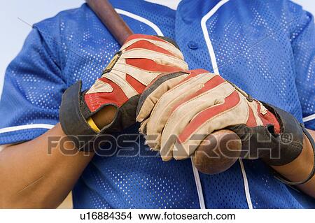 Picture - Baseball player holding batter, (close-up), (mid section). Fotosearch